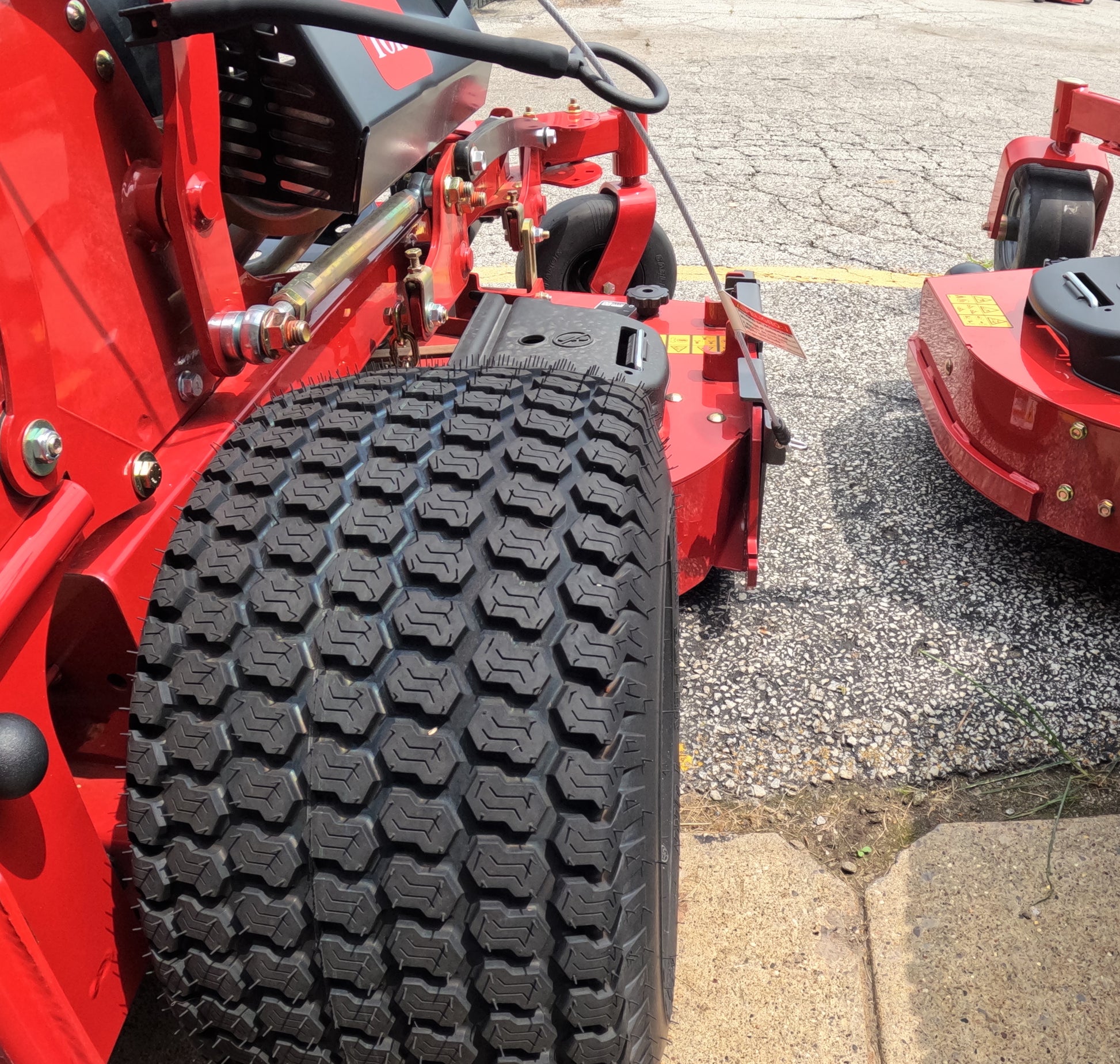 Grass deflector for commercial mowers